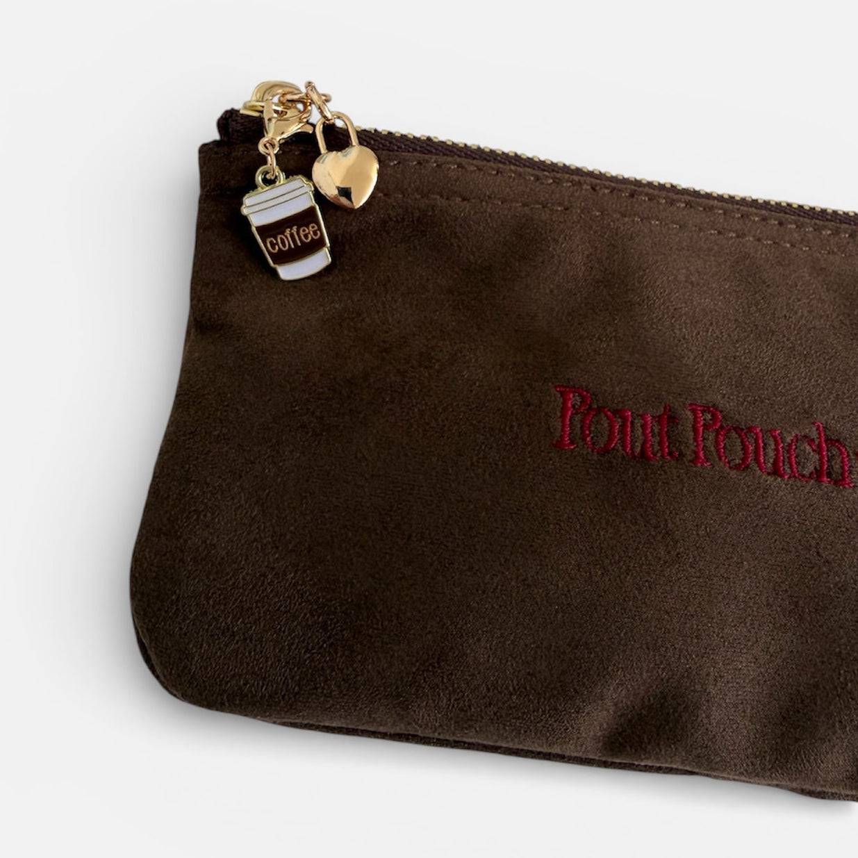 Coffee cup charm attached to Pout Pouch makeup pouch