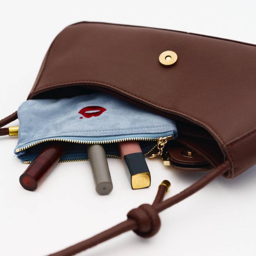 Powder blue Pout Pouch organising lipstick and makeup inside handbag